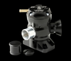 GFB Hybrid TMS dual outlet blow off valve, angled view showing brass barb inlet, aluminum outlet and side vent horn