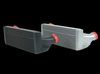 CSF stepped core intercooler pair, black and silver finish, front angle with red silicone couplers and inlet/outlet pipes visible