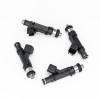Set of four DeatschWerks 1000cc fuel injectors for Mazda Miata, arranged in circle showing electrical connectors and nozzle tips.