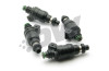 DeatschWerks 1000cc top feed fuel injectors, set of four, black bodies with green O-rings, angled view