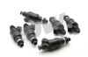 DeatschWerks 1000cc top feed injectors for RB26DETT, set of six, angled view showing fuel inlets and nozzle tips