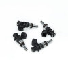 Set of four DeatschWerks EV14 1200cc fuel injectors, angled view showing connectors and O-rings