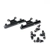 DeatschWerks top feed fuel rail kit with 2200cc injectors, black rails and six injectors shown at an angle.