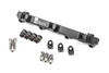 Radium Engineering fuel rail for Toyota MR2 3S-GTE, angled view with mounting bolts, hex fittings, and brackets