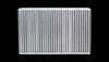 Vibrant Vertical Flow Intercooler, front view showing dense vertical cooling fins on a bare aluminum core
