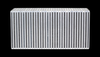 Vibrant vertical flow intercooler core, front view showing dense fin rows on a bare aluminum finish.
