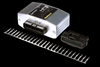 Haltech HPI6 igniter unit, black connector plug, and rows of metal pins on black background