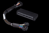 Haltech Elite 1000-2500 Plug-n-Play Adaptor Harness, black connector box with braided wiring loom and multi-pin plugs on black background