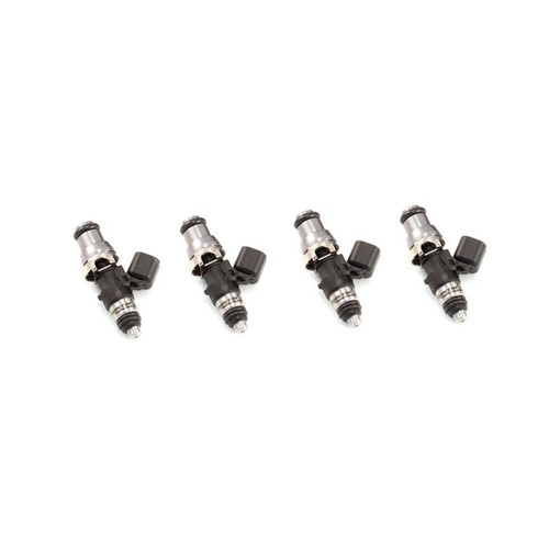 Set of four Injector Dynamics 1050cc fuel injectors, angled view showing electrical connectors and lower nozzle tips