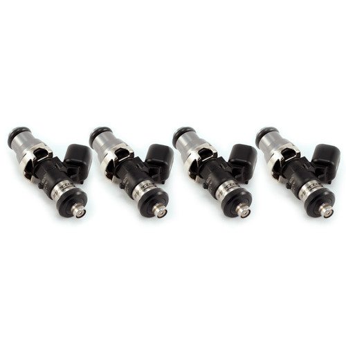 Injector Dynamics ID1300X fuel injectors, set of four, angled view showing top connectors and nozzle tips