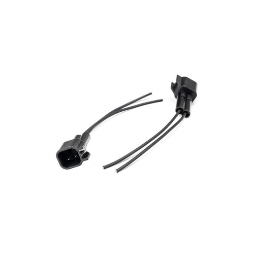 Injector Dynamics USCAR male connector pigtail kit, two wired plugs shown at angle on white background