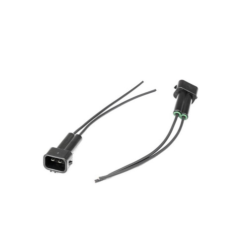 Injector Dynamics OBD2 Honda male connector pigtail kit, two black plugs with bare wire leads shown side by side.