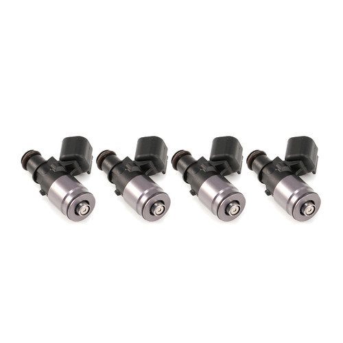 Set of four Injector Dynamics 1300-XDS fuel injectors with 11mm machined tops, angled view showing electrical connectors and nozzle tips