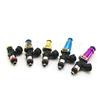 Set of four Injector Dynamics 1300-XDS fuel injectors, angled view, colored bodies with black connectors and lower o-rings