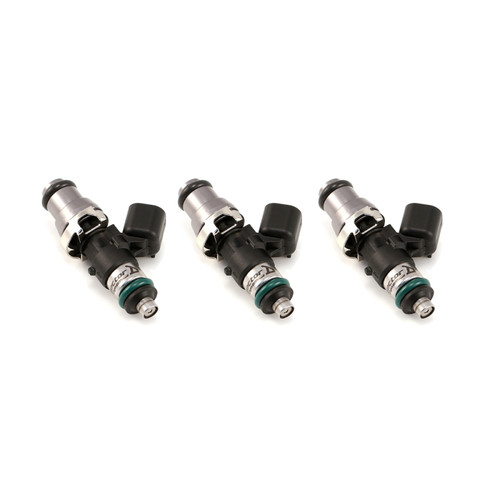 Set of three Injector Dynamics 1340cc fuel injectors, angled view showing grey tops and green lower O-rings