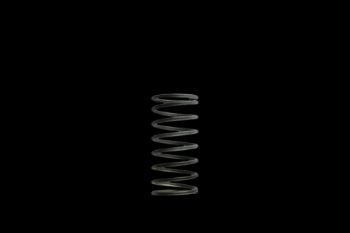 Turbosmart WG50/60 5PSI wastegate spring, black and gray, shown upright on black background