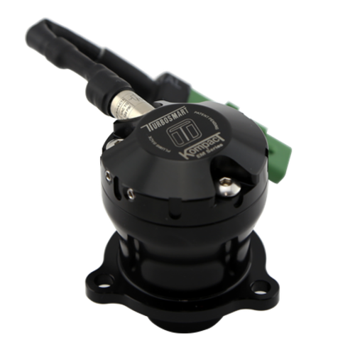 Turbosmart BOV Kompact EM Plumb Back VR10 for Mini Cooper S, angled top view showing black valve body, hose fitting, and green electrical connector.