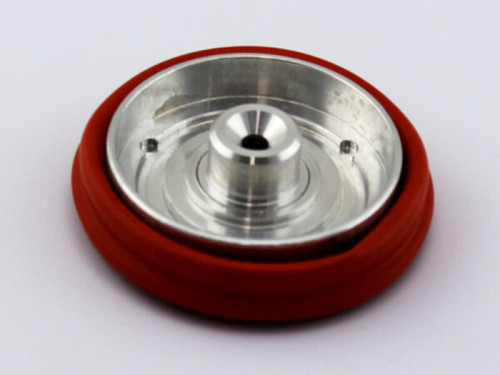 Turbosmart BOV Power Port Diaphragm replacement, angled top view showing metal disc and red silicone seal