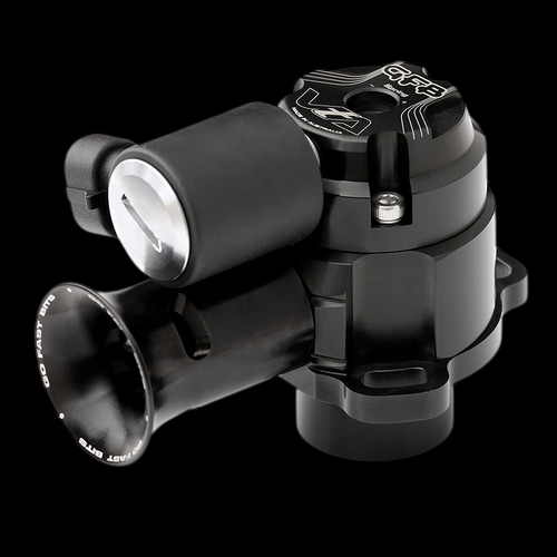 GFB VTA blow off valve shown at an angle, black anodized body with silver piston and trumpet outlet visible.