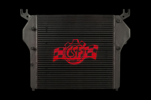 CSF charge air cooler for 10-12 Dodge Ram 6.7L, front view showing core fins and mounting brackets