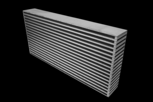 CSF bar and plate intercooler core, angled view showing stacked cooling fins and end tank on a black background