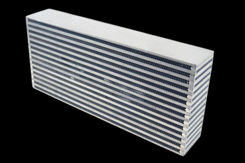 CSF Magnum 900+hp bar and plate intercooler core, angled view showing fin rows and end tank openings
