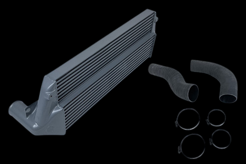 CSF silver stepped core intercooler with two silicone hoses and four hose clamps, angled view