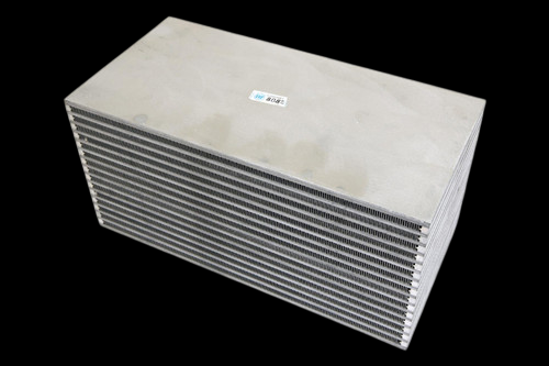 CSF bar and plate intercooler core, angled view showing stacked cooling fins and smooth top and side panels.