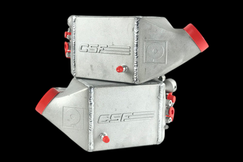 CSF twin charge air cooler set for BMW M5 F10 and M6, raw aluminum with red end caps, angled view