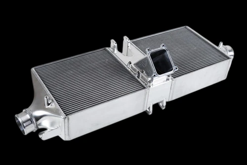 CSF intercooler for Porsche 992 Turbo/S, angled view showing dual cores, center inlet and end tanks.