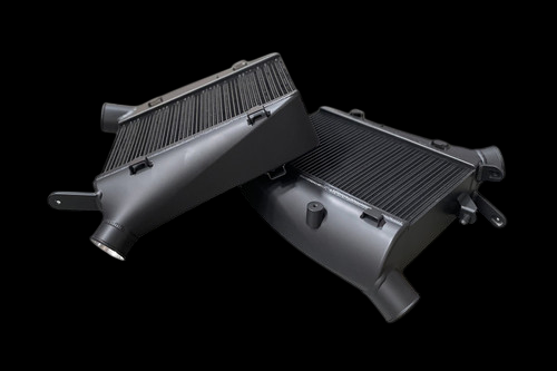 CSF intercooler system for Audi C8 RS6/RS7, black finish, angled view showing cores, end tanks, and inlet/outlet pipes.
