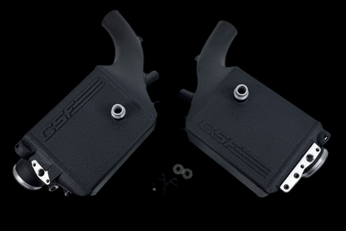 CSF charge air cooler pair for BMW G90/G99 M5, angled view showing inlet necks and hose fittings