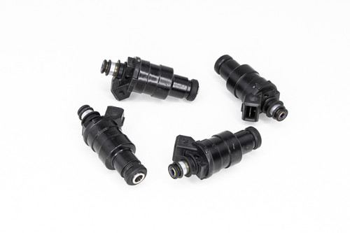 Set of four DeatschWerks 550cc fuel injectors, black bodies, 11mm tops, angled view showing electrical connectors