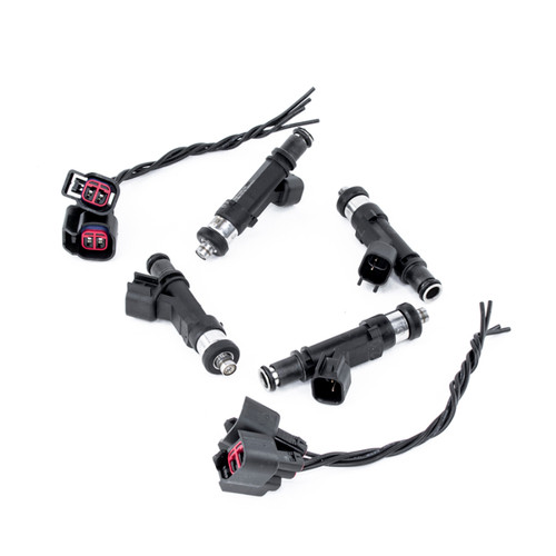 DeatschWerks 650cc fuel injectors, set of four with two wiring connectors, black bodies on white background.