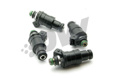 Set of four DeatschWerks 1200cc top feed fuel injectors for Evo VIII/IX and 4G63T DSM, black bodies with green O-rings.