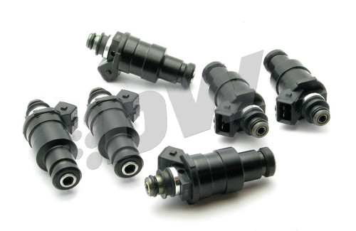 DeatschWerks 1200cc top feed injectors for RB26DETT GTR, set of six shown at angled front view with connectors and O-rings visible
