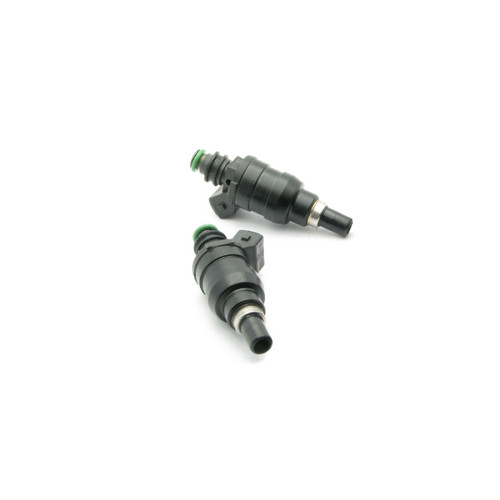 DeatschWerks 800cc top feed fuel injectors for 86-87 RX7 FC, pair shown with green O-rings and electrical connectors visible.