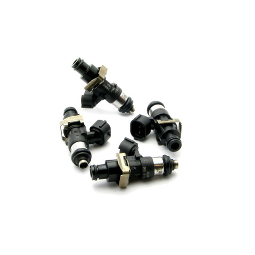 Set of four DeatschWerks EV14 220lb/hr fuel injectors arranged in a circle, showing black bodies, metal clips, top and side ports.