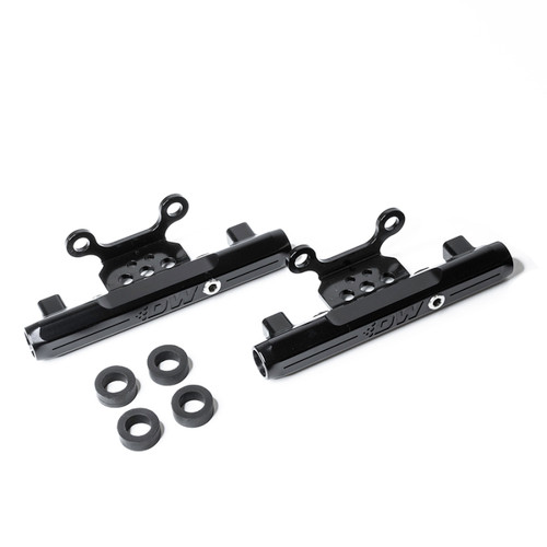 DeatschWerks side feed fuel rails for Subaru STI and Legacy GT, pair shown with black anodized finish and four rubber grommets.