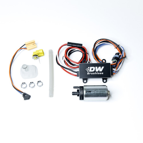 DeatschWerks DW440 brushless fuel pump kit with C102 controller, wiring harness, and install parts laid flat, top view