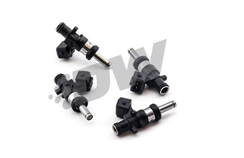 Set of four DeatschWerks EV14 1200cc fuel injectors, black bodies with metal fuel rail connectors, angled view.