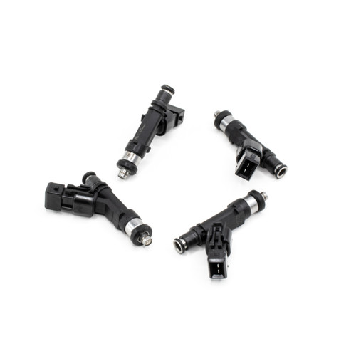 Set of four DeatschWerks 550cc top feed fuel injectors for 240sx SOHC, angled view showing electrical connectors