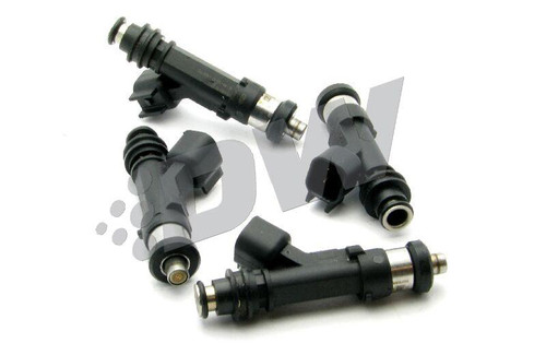 Set of four DeatschWerks 800cc fuel injectors, top down angle showing electrical connectors and O-ring tips.