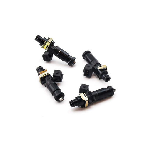Set of four Deatschwerks Bosch EV14 1250cc fuel injectors, black bodies with brass mounting clips, top down angle.