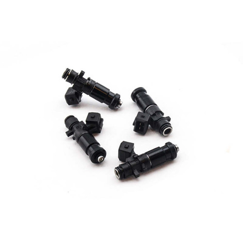 Set of four Deatschwerks Bosch EV14 1250cc fuel injectors, black, top angled view showing electrical connectors and nozzle tips.