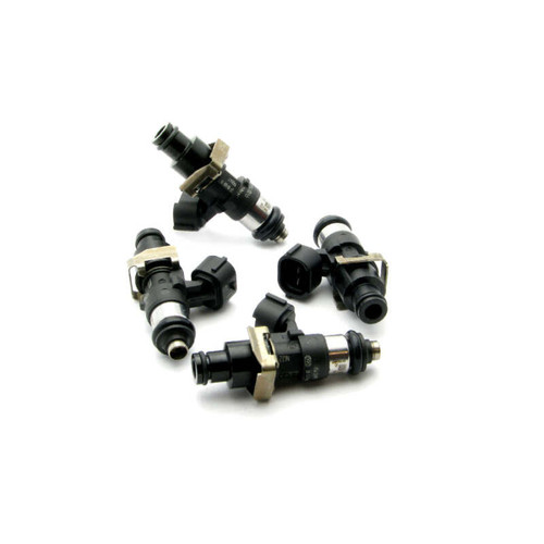 Set of four DeatschWerks EV14 2400cc fuel injectors, arranged in a circle, top angled view showing electrical connectors and o-rings