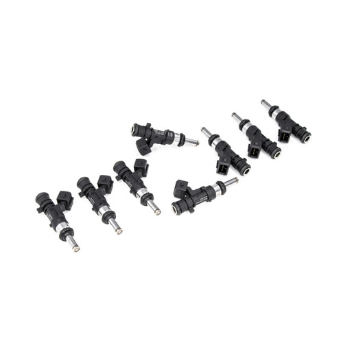 Set of 8 DeatschWerks 600cc fuel injectors for M156 C63, arranged in a diagonal row showing electrical connectors and nozzle tips.
