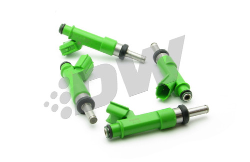 Set of four DeatschWerks 550cc fuel injectors for Scion tc, green bodies with metal nozzles arranged in a cluster.