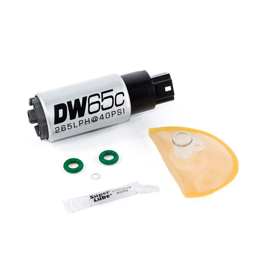 DeatschWerks DW65C fuel pump with green seals, sock filter, and grease packet, top angled view