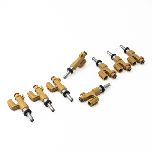 DeatschWerks 650cc fuel injectors, set of 8, angled view showing nozzle tips and electrical connectors